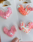 2PK NOVELTY CLIPS: bubble confetti hearts coral