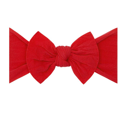 a red bow on a white background
